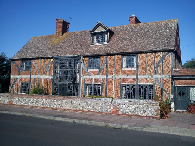 A timber framed house with diagonal patterned brickwork